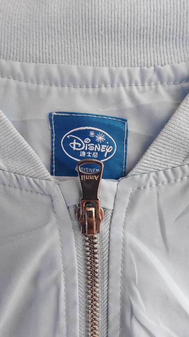 Disney Frozen Elsa & Anna Bomber Jacket (Category: Babies & Kids Fashion) located in Caloocan City. Submitted by luckybunny_8888 (Listing ID 1463346026, Image 3). Description: - Light blue bomber jacket featuring Disney's Frozen characters Elsa and Anna. - 'I LOVE ELSA' text detail on the sleeve. - 'Beautiful Sisters' text detail on the back. - Zip-up front closure. - Two functional pockets. - Ideal for any fan of the movie Frozen..