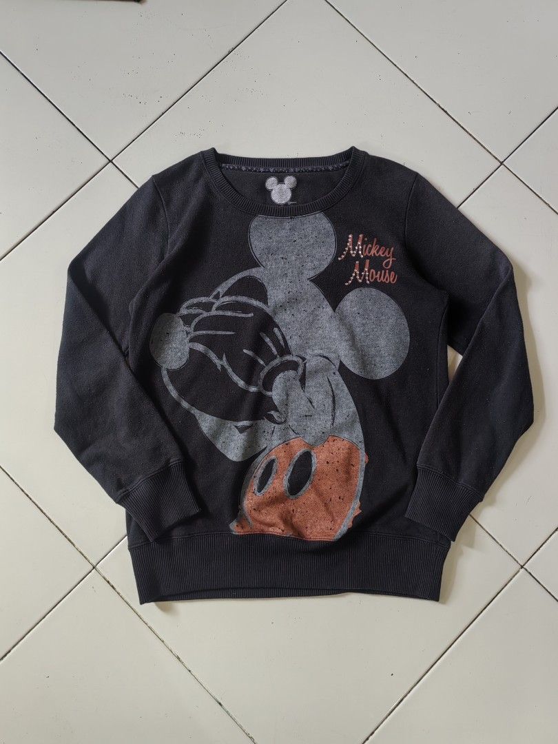 Disney Mickey Mouse Graphic Sweatshirt (Category: Longsleeves) located in Manila. Submitted by livedolphin_68dee2 (Listing ID 1463482283, Image 1). Description: - Black long-sleeved sweatshirt - Large distressed Mickey Mouse graphic - 'Mickey Mouse' text with sparkly details - Ribbed cuffs and hem - Ideal for casual wear.