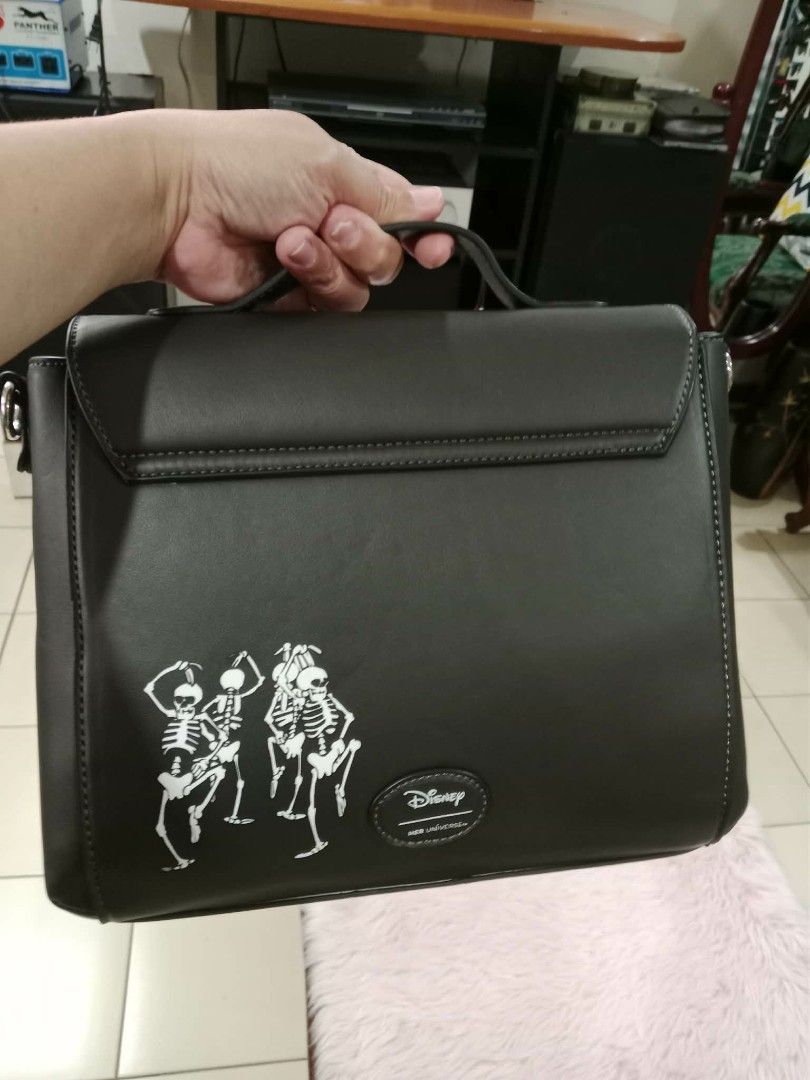 Disney Skeleton Piano Crossbody Bag (Category: Cross-body Bags) located in Pasig City. Submitted by janalopez904 (Listing ID 1462863996, Image 2). Description: -Glow in the dark - Unique Disney bag featuring a skeleton and piano design. - Classic black with stylish white accents. - Comes with a comfortable top handle. - Includes a detachable crossbody strap for versatile carrying. - Ideal for Halloween or adding a touch of fun to any outfit. - St