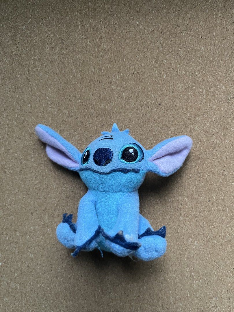 Disney Stitch Plush Toy (Category: Plushies & Soft Toys) located in Baguio. Submitted by gaara1234 (Listing ID 1463391362, Image 1). Description: - Adorable blue Stitch plush toy - Sitting pose with iconic big ears and eyes - Ideal for Disney fans and collectors - Compact size, perfect for display - Made with soft and cuddly material.