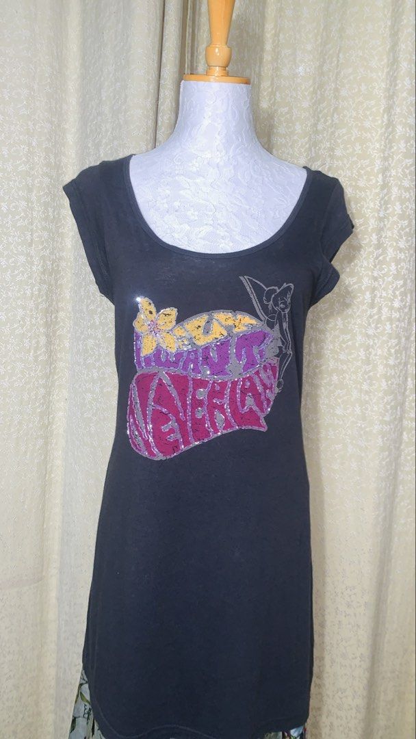 Disney Tinkerbell Graphic T-Shirt (Category: Shirts) located in Dagupan City. Submitted by sj_styles0910. (Listing ID 1463534140, Image 1). Description: - Dark grey t-shirt featuring a fun Tinkerbell graphic - Graphic includes colorful sequins and glitter details - Made from a soft rayon and cotton blend for comfort - Ideal for any Disney fan - Officially branded by Disney (check tag).