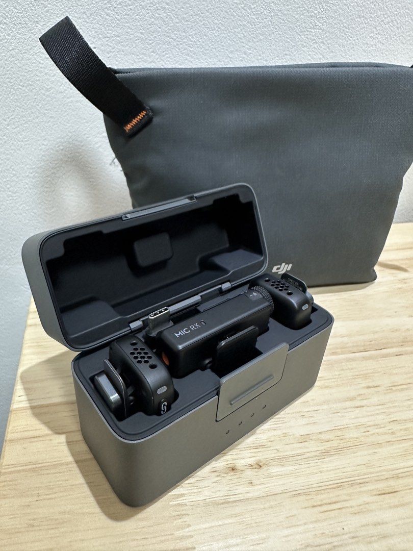 DJI Mic Mini Wireless Microphone System with Charging Case (Category: Microphones) located in Cavite. Submitted by jl.listings (Listing ID 1463330969, Image 2). Description: - DJI Mic system - Includes receiver, transmitter, and charging case - Comes with a grey pouch for storage - Perfect for vlogging and content creation - All items fit compactly into the charging case - Can be used on phone, include mobile adapter Originally bought at 7k plus.