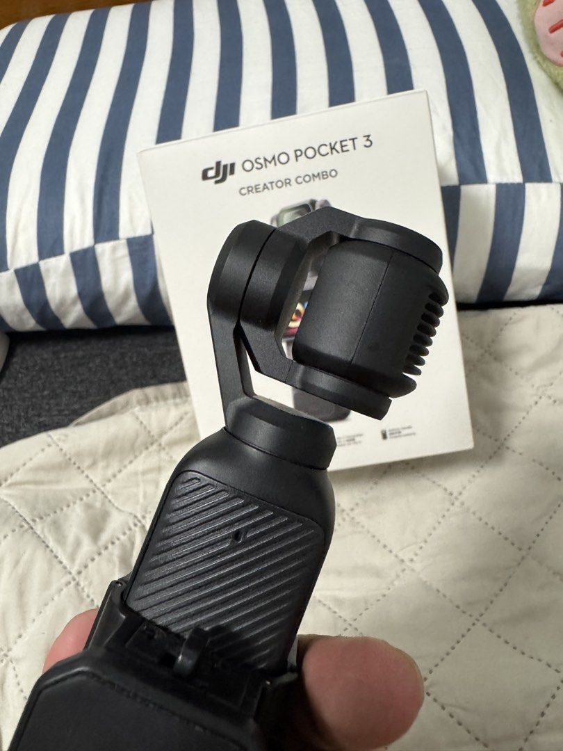 DJi Osmo Pocket 3 Creator Combo (Category: Video Cameras) located in Manila. Submitted by austineko81021 (Listing ID 1463383943, Image 3). Description: DJI Osmo Pocket 3 Creator Combo * DJI Osmo Pocket 3 * Original Box * Black Carrying Bag * Osmo Protective Cover * DJI Mic 2 Transmitter * DJI Mic 2 Clip Magnet * DJI Mic 2 Windscreen * Handle with 1/4” Thread * Battery Handle * Mini Tripod * (replacement) Type-C PD Cable * Wide-Angle Lens .