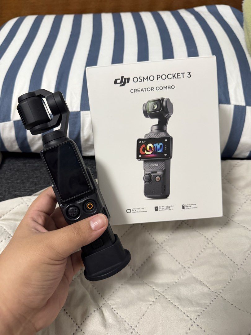 DJi Osmo Pocket 3 Creator Combo (Category: Video Cameras) located in Manila. Submitted by austineko81021 (Listing ID 1463383943, Image 1). Description: DJI Osmo Pocket 3 Creator Combo * DJI Osmo Pocket 3 * Original Box * Black Carrying Bag * Osmo Protective Cover * DJI Mic 2 Transmitter * DJI Mic 2 Clip Magnet * DJI Mic 2 Windscreen * Handle with 1/4” Thread * Battery Handle * Mini Tripod * (replacement) Type-C PD Cable * Wide-Angle Lens .