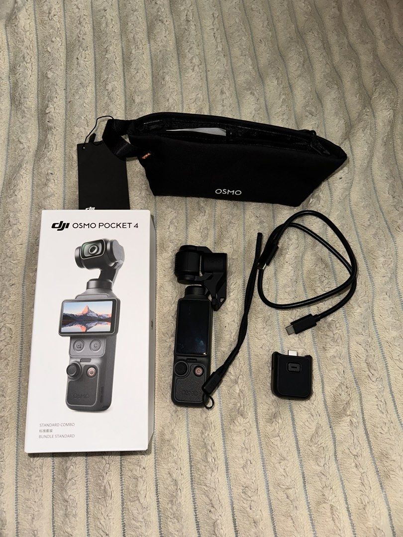 DJI Osmo Pocket 4 Standard Combo Gimbal (Category: Cameras) located in Cainta. Submitted by el.declutterz (Listing ID 1463328986, Image 1). Description: - DJI Osmo Pocket 4 Standard Combo - Includes: Gimbal clamp, charging cable, carrying pouch, handle - All items are in the original box -Has Tempered glass installed -just bought sept 2026, used twice - NEEWER wide angle lens (0.75) +₱800 -rfs: need funds - last price posted 📍ortigas, pasig or c