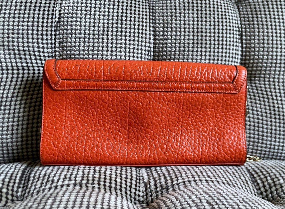 DKNY orange textured purse (Category: Shoulder Bags) located in Bulacan. Submitted by thriftbagcollections (Listing ID 1463409064, Image 2). Description: DKNY orange textured purse with chain strap,Good condition!Approx:H-5.5”W-9.7” strap 8.5”.