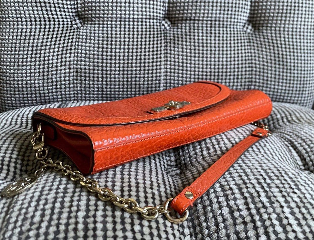 DKNY orange textured purse (Category: Shoulder Bags) located in Bulacan. Submitted by thriftbagcollections (Listing ID 1463409064, Image 3). Description: DKNY orange textured purse with chain strap,Good condition!Approx:H-5.5”W-9.7” strap 8.5”.