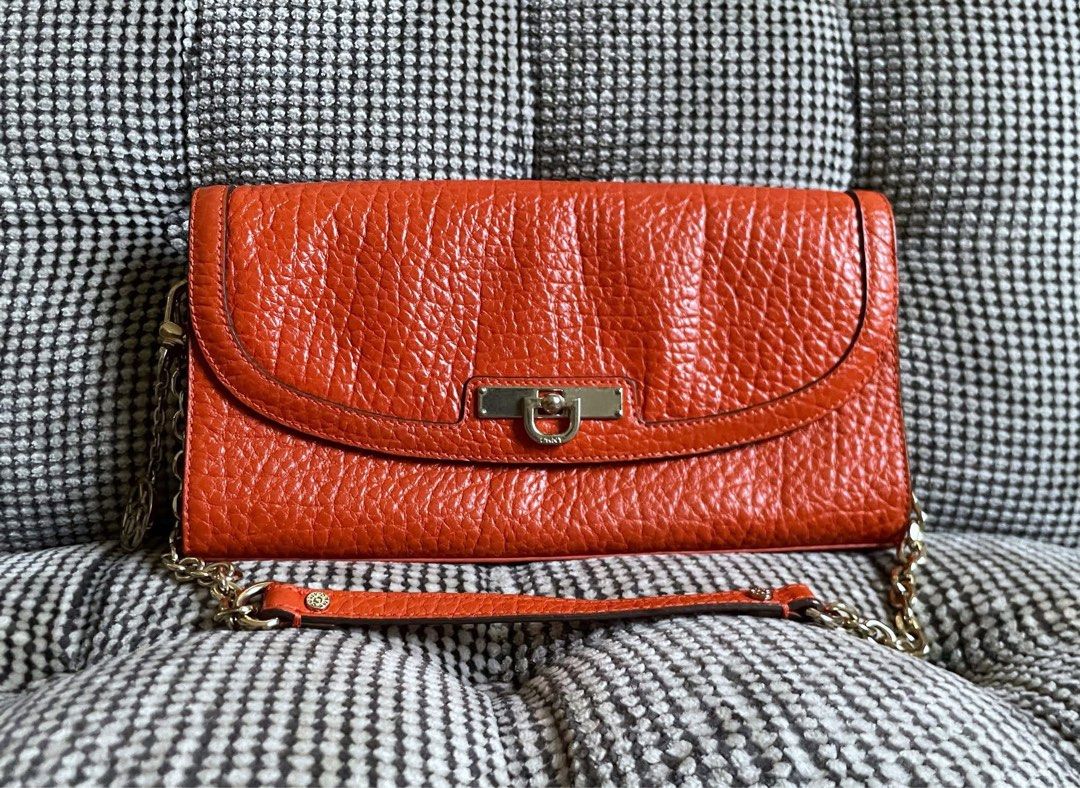 DKNY orange textured purse (Category: Shoulder Bags) located in Bulacan. Submitted by thriftbagcollections (Listing ID 1463409064, Image 1). Description: DKNY orange textured purse with chain strap,Good condition!Approx:H-5.5”W-9.7” strap 8.5”.