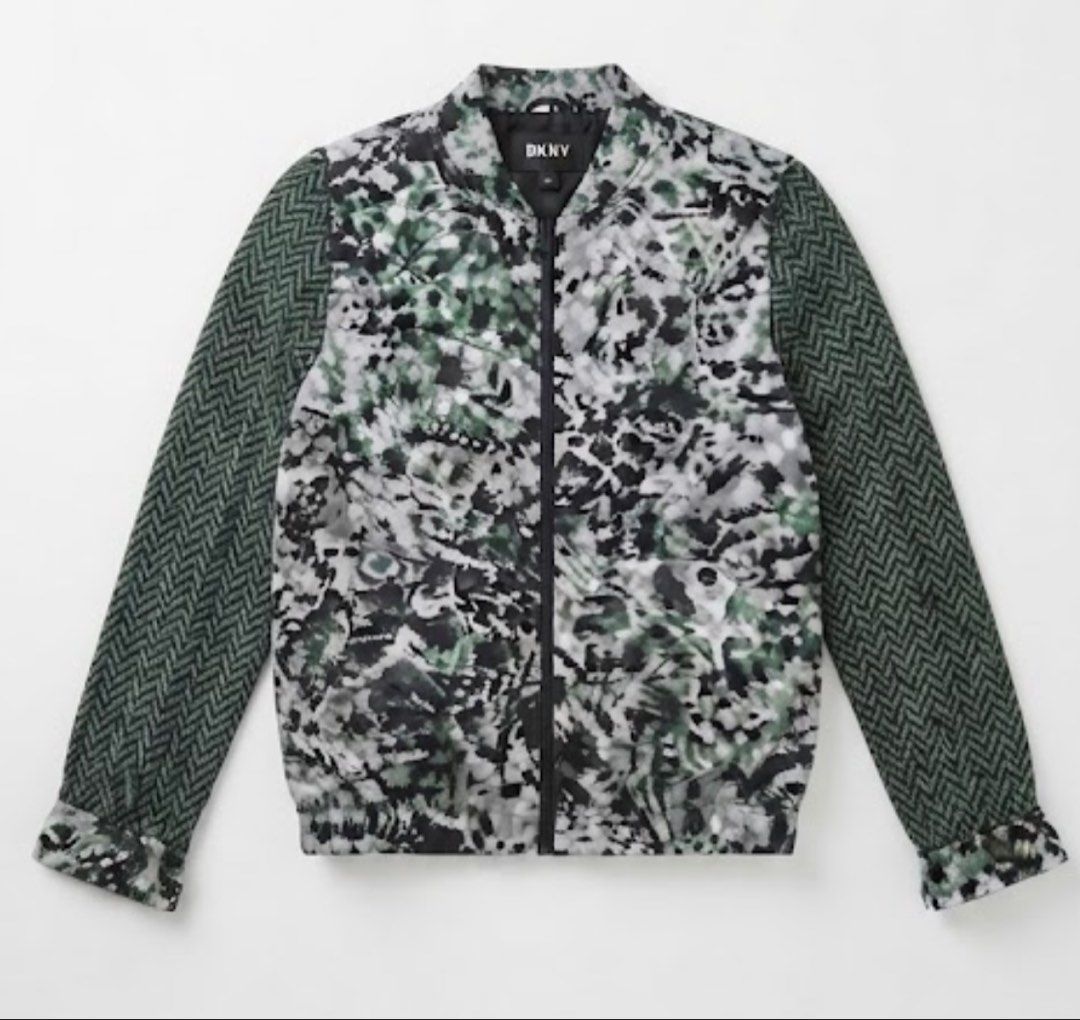 DKNY silk Bomber Jacket - Camo Print with Herringbone Sleeves (Category: Longsleeves) located in Donsol. Submitted by saksthriftavenuebyluckymaria8 (Listing ID 1463454551, Image 2). Description: - Cool DKNY bomber jacket - Unique camouflage print on body - Contrasting dark green herringbone sleeves - Zipper closure - Size 6 - Perfect statement piece for your wardrobe DKNY Silk zipper collarless top Sz 6 chest 22in armhole 9.5 in shoulder 17in len