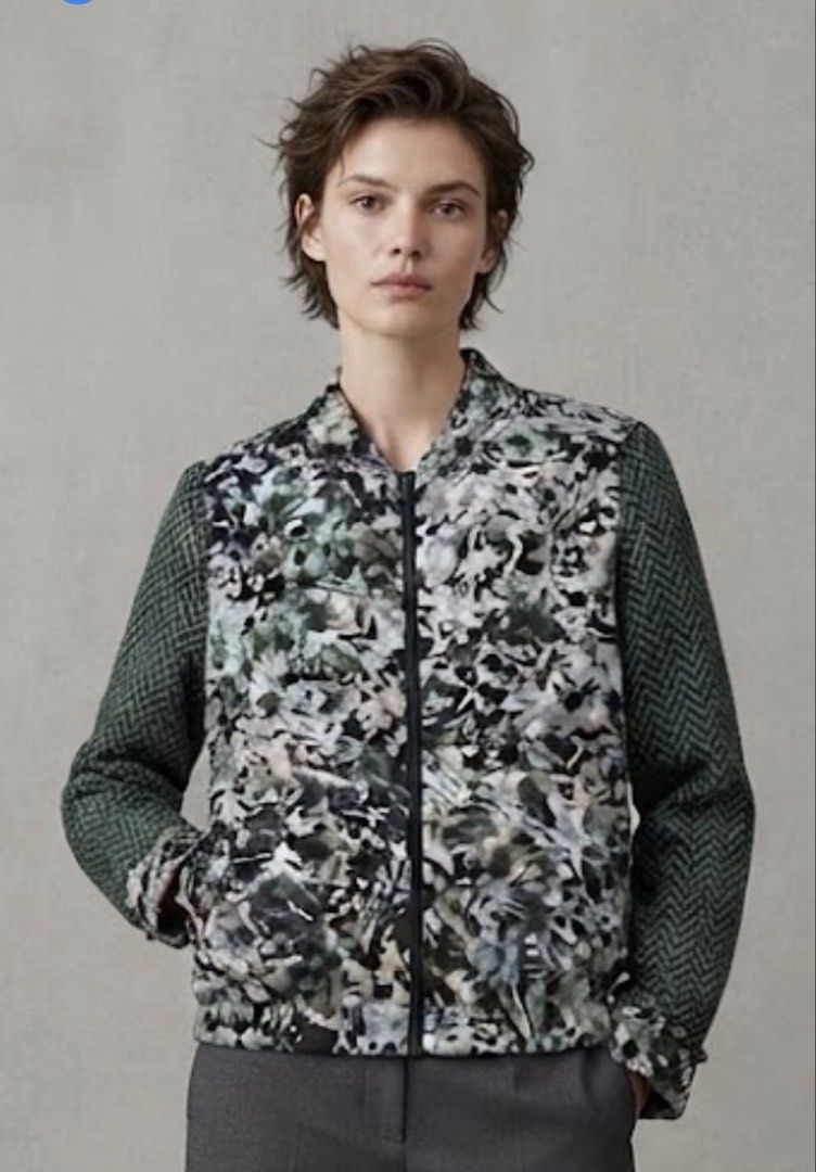 DKNY silk Bomber Jacket - Camo Print with Herringbone Sleeves (Category: Longsleeves) located in Donsol. Submitted by saksthriftavenuebyluckymaria8 (Listing ID 1463454551, Image 1). Description: - Cool DKNY bomber jacket - Unique camouflage print on body - Contrasting dark green herringbone sleeves - Zipper closure - Size 6 - Perfect statement piece for your wardrobe DKNY Silk zipper collarless top Sz 6 chest 22in armhole 9.5 in shoulder 17in len
