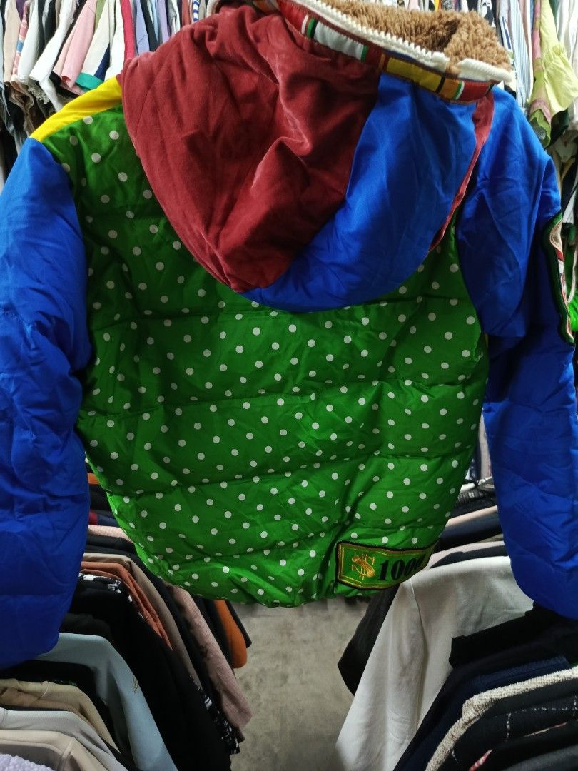 D.N.F. Dangerous Patchwork Puffer Jacket (Category: Coats, Jackets and Outerwear) located in Cabatuan. Submitted by penthegreat (Listing ID 1463462178, Image 3). Description: - Unique patchwork puffer jacket - Striking yellow and blue color block design - Features cool patches like 'Dangerous' and 'Diamond' - Green polka dot pattern on the back - Cozy fur-lined collar for extra warmth - Stand out with this eye-catching piece.