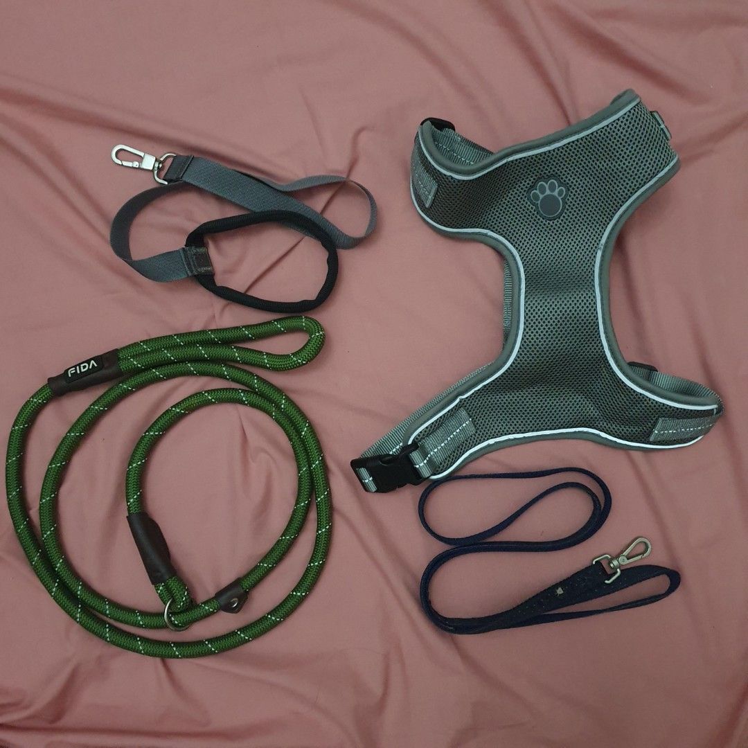 Dog Harness and Leash Set (Category: Homes & Other Pet Accessories) located in Paranaque City. Submitted by cobien (Listing ID 1463474078, Image 1). Description: - Grey mesh dog harness with reflective trim - Dark blue patterned leash included - Green FIDA rope leash with comfortable handle - Rope leash is adjustable and can be used as a slip lead - Great for walks and training.