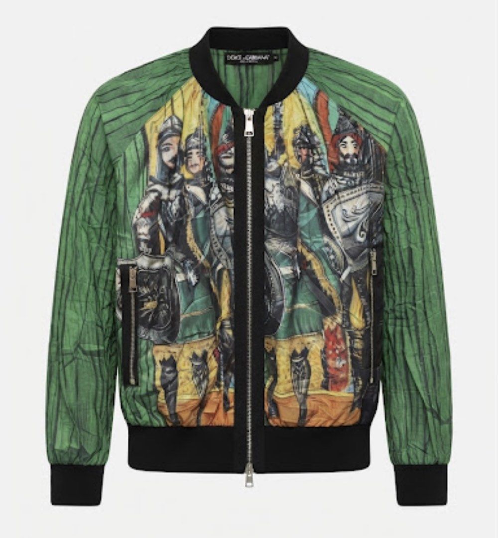 Dolce & Gabbana Knight Print lightweight Bomber Jacket (Category: Longsleeves) located in Donsol. Submitted by saksthriftavenuebyluckymaria8 (Listing ID 1463454013, Image 3). Description: - Stylish green bomber jacket - Features a bold knight print - Full zip closure - Ribbed cuffs and hem for a comfortable fit - Made in Italy - High-quality Lampo zipper hardware - Dolce & Gabbana zipper pull Dolce & Gabbana bomber jacket featuring a distinctive 