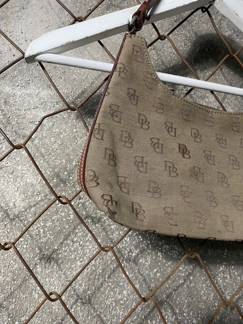 Y2k monogram Dooney & Bourke Monogram Shoulder Bag (Category: Activewear) located in Cabanatuan. Submitted by brightwater-2083 (Listing ID 1463507255, Image 3). Description: - Classic Dooney & Bourke shoulder bag - All-over DB monogram pattern - Tan canvas with brown leather trim - Secure zipper closure - Ideal for everyday use.