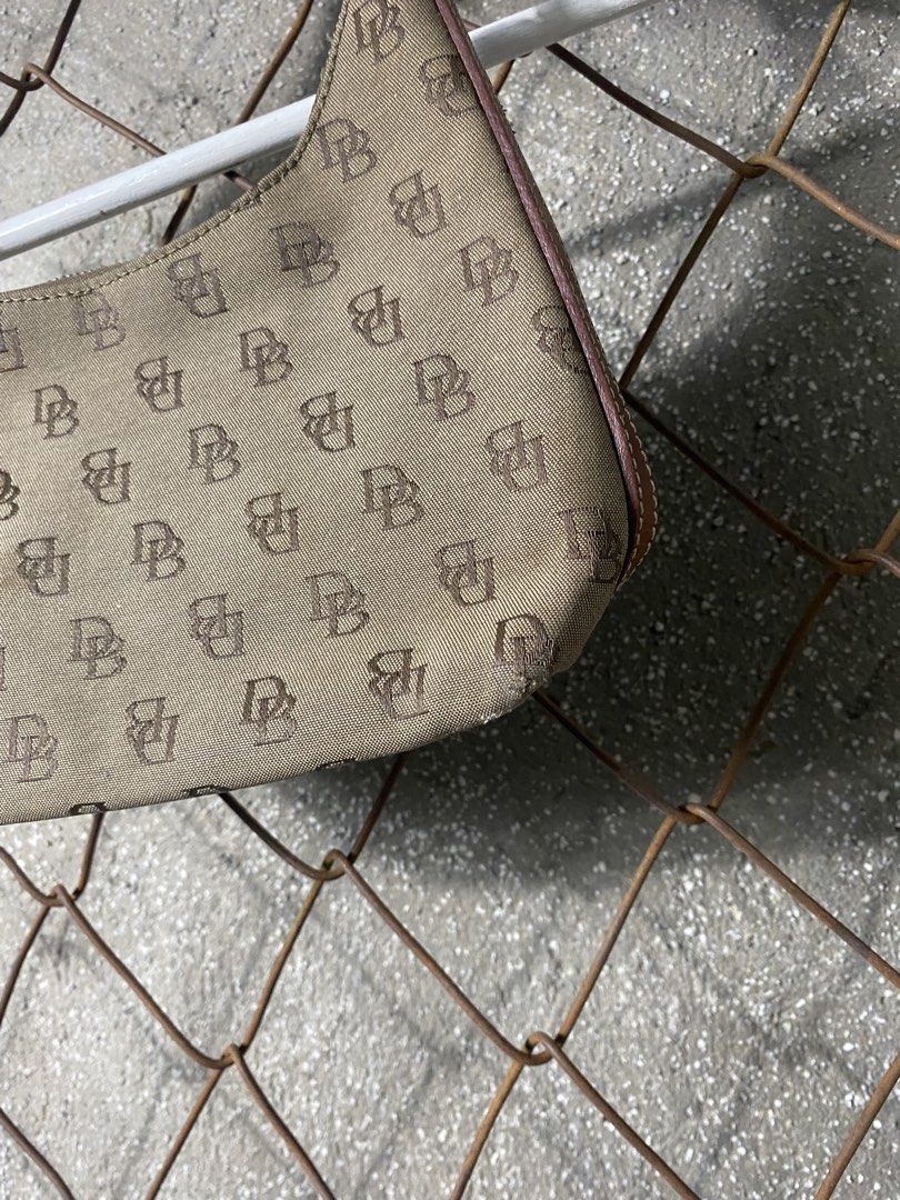 Y2k monogram Dooney & Bourke Monogram Shoulder Bag (Category: Activewear) located in Cabanatuan. Submitted by brightwater-2083 (Listing ID 1463507255, Image 2). Description: - Classic Dooney & Bourke shoulder bag - All-over DB monogram pattern - Tan canvas with brown leather trim - Secure zipper closure - Ideal for everyday use.