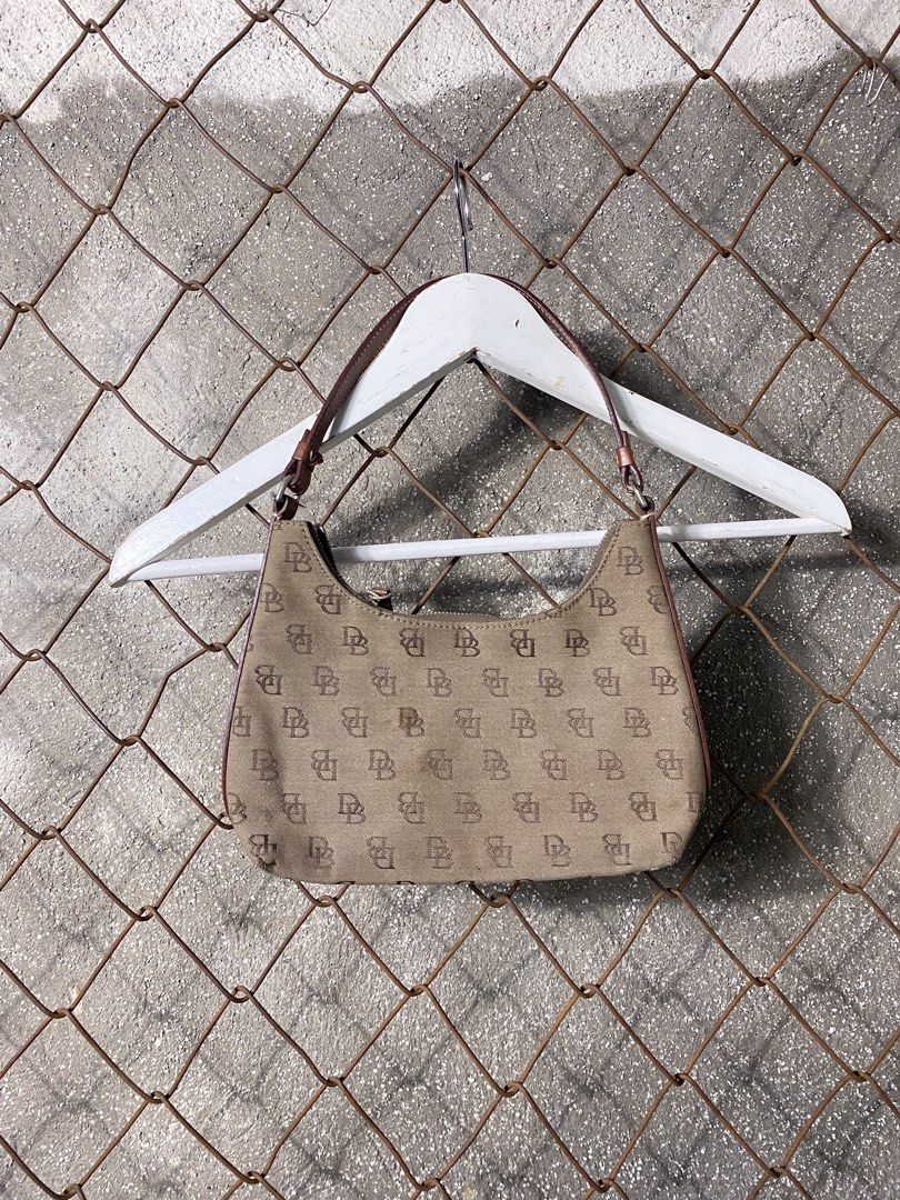 Y2k monogram Dooney & Bourke Monogram Shoulder Bag (Category: Activewear) located in Cabanatuan. Submitted by brightwater-2083 (Listing ID 1463507255, Image 1). Description: - Classic Dooney & Bourke shoulder bag - All-over DB monogram pattern - Tan canvas with brown leather trim - Secure zipper closure - Ideal for everyday use.