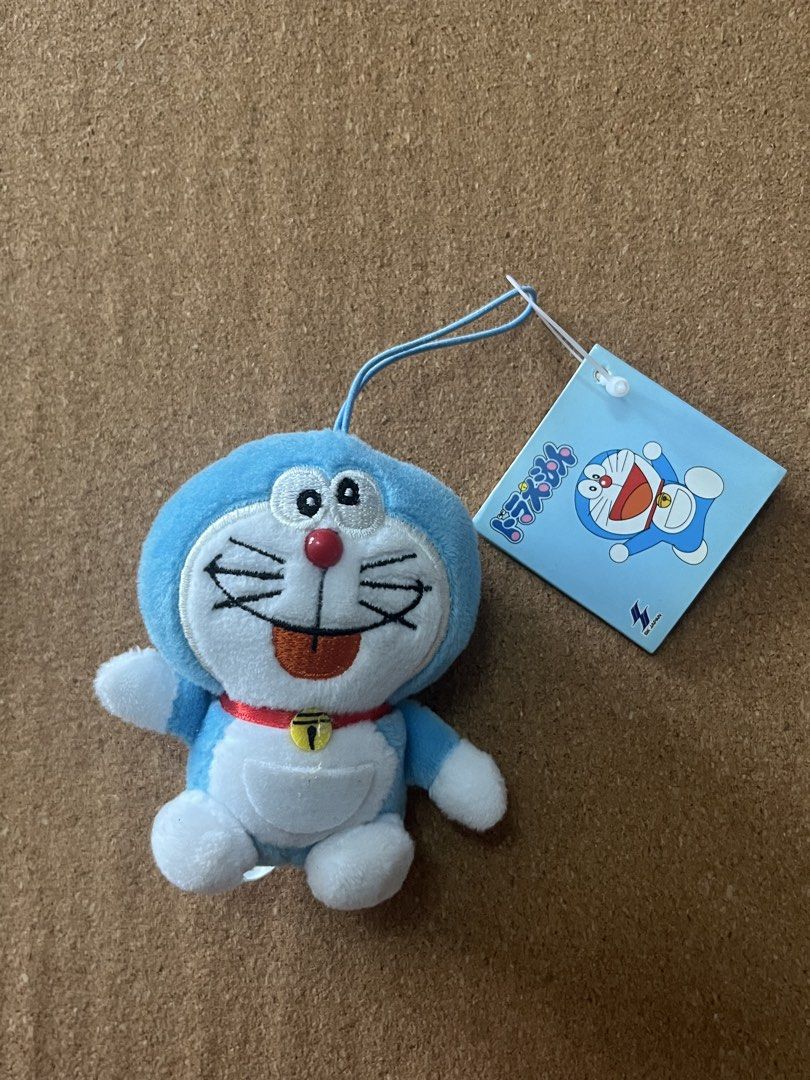 Doraemon Plush Toy with Tag (Category: Plushies & Soft Toys) located in Baguio. Submitted by gaara1234 (Listing ID 1463350651, Image 1). Description: - Adorable Doraemon plush toy - Original tag still attached - Ideal for Doraemon enthusiasts - Perfect for display or gifting - Soft and huggable material.