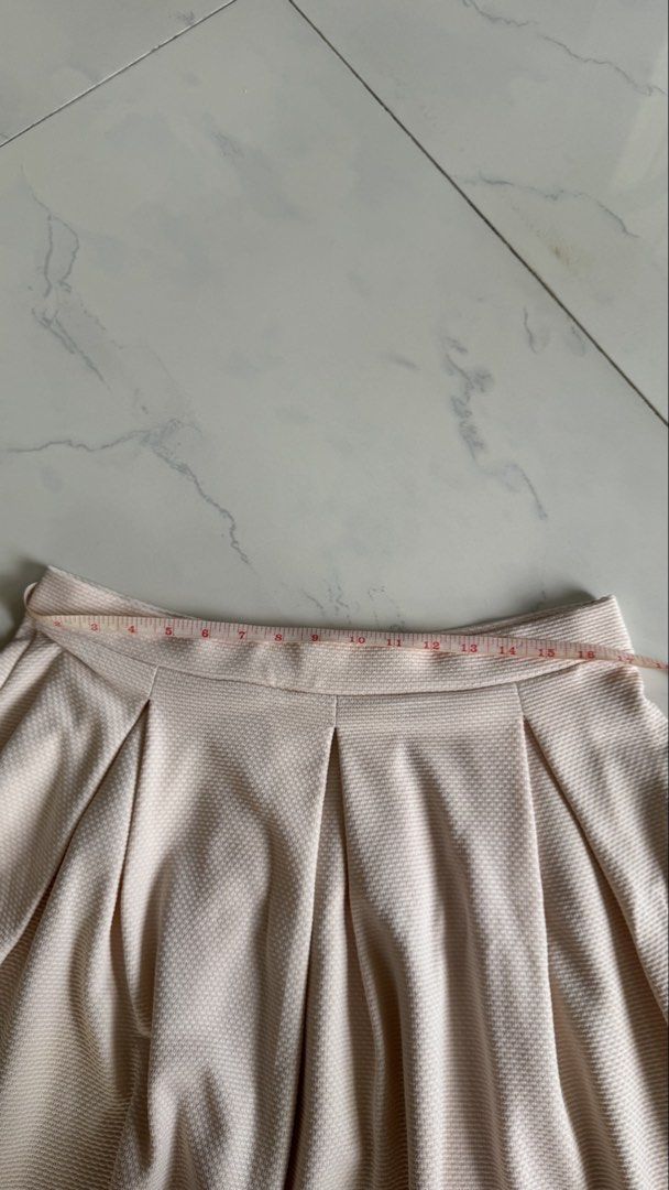 Dorothy Perkins Pleated Skirt (Category: Skirts) located in Manila. Submitted by patc20 (Listing ID 1463371964, Image 3). Description: - Light pink pleated skirt - Brand: Dorothy Perkins - Textured fabric - Waistband: Approx. 13 inches across - Skirt length: Approx. 19 inches - Easy to style for casual or dressy occasions.