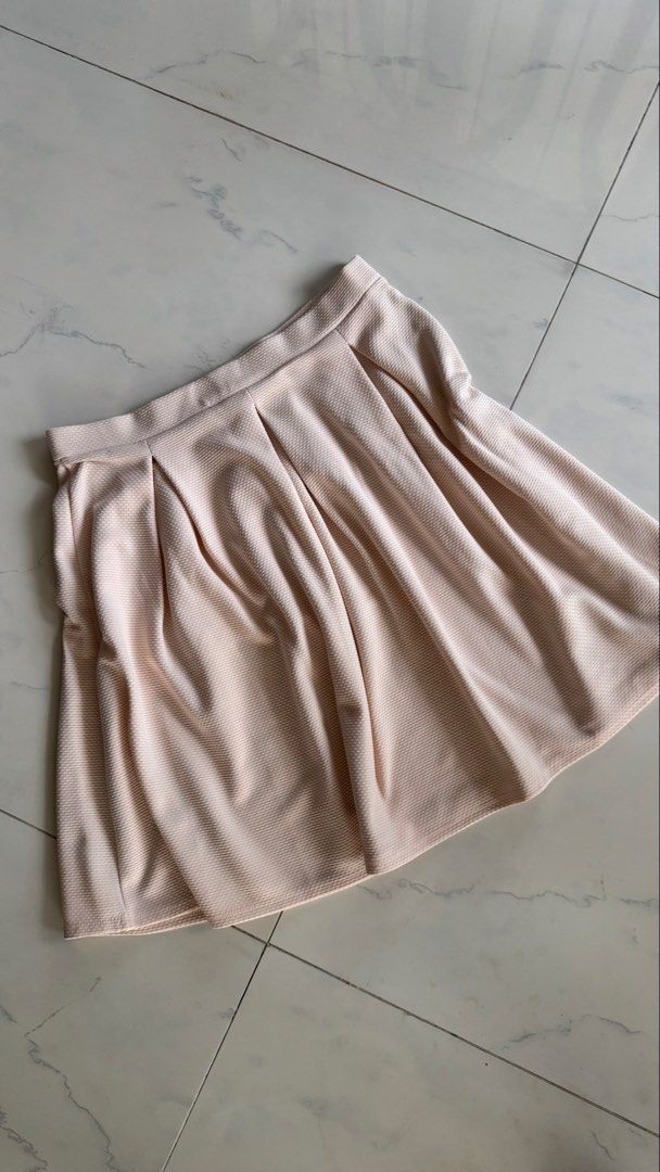 Dorothy Perkins Pleated Skirt (Category: Skirts) located in Manila. Submitted by patc20 (Listing ID 1463371964, Image 1). Description: - Light pink pleated skirt - Brand: Dorothy Perkins - Textured fabric - Waistband: Approx. 13 inches across - Skirt length: Approx. 19 inches - Easy to style for casual or dressy occasions.