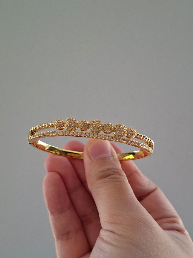 Double Layer Bubbles Gold Zirconia Stones Bangle Bracelet (Category: Bracelets) located in Dasmarinas. Submitted by danabrie22 (Listing ID 1463447897, Image 1). Description: brand new - stainless steel - cubic zirconia stones 10/10 condition from Hongkong.