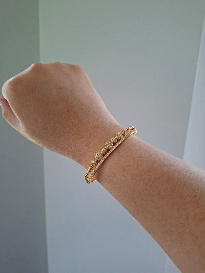 Double Layer Bubbles Gold Zirconia Stones Bangle Bracelet (Category: Bracelets) located in Dasmarinas. Submitted by danabrie22 (Listing ID 1463447897, Image 2). Description: brand new - stainless steel - cubic zirconia stones 10/10 condition from Hongkong.