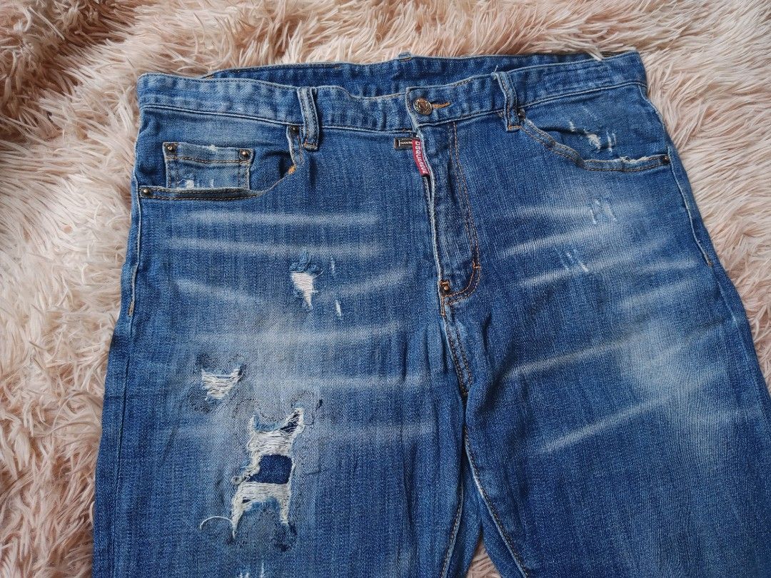 DSQUARED2 Red Tag Distressed Blue Denim Jeans Size 34 (Category: Jeans) located in Boston. Submitted by johnpaulvi30029 (Listing ID 1463403691, Image 3). Description: - DSQUARED2 Blue Denim Jeans - Size: 34 - Style: Distressed with rips and fading - Closure: Button fly - Origin: Made in Italy - Condition: Please check photos for all details.
