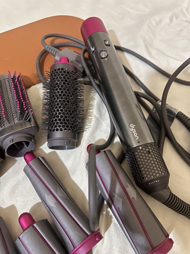 DYSON AIRWRAP MULTI-STYLER (Category: Hair) located in Santa Rosa. Submitted by aerislove (Listing ID 1463372030, Image 3). Description: 📦 Inclusions: • Dyson Airwrap main unit • Multiple styling attachments • Storage case (optional if you want to include pa because it’s heavily damaged) • Accessories shown in photos • Original cord/power adapter 📌 Condition: Pre-loved / used • All items shown are included • Some visible signs of use on the sto