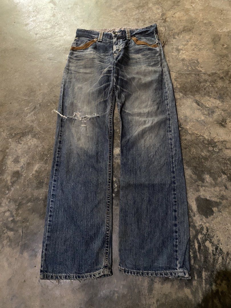 edwin bootcut (Category: Jeans) located in Manila. Submitted by coollion.19b40f (Listing ID 1463344173, Image 1). Description: - Relaxed fit blue denim jeans - Distressed detailing on the knee - Unique brown accent on pockets - Patterned lining on the waistband - Comfortable worn-in look and feel - Perfect for a casual, edgy style.