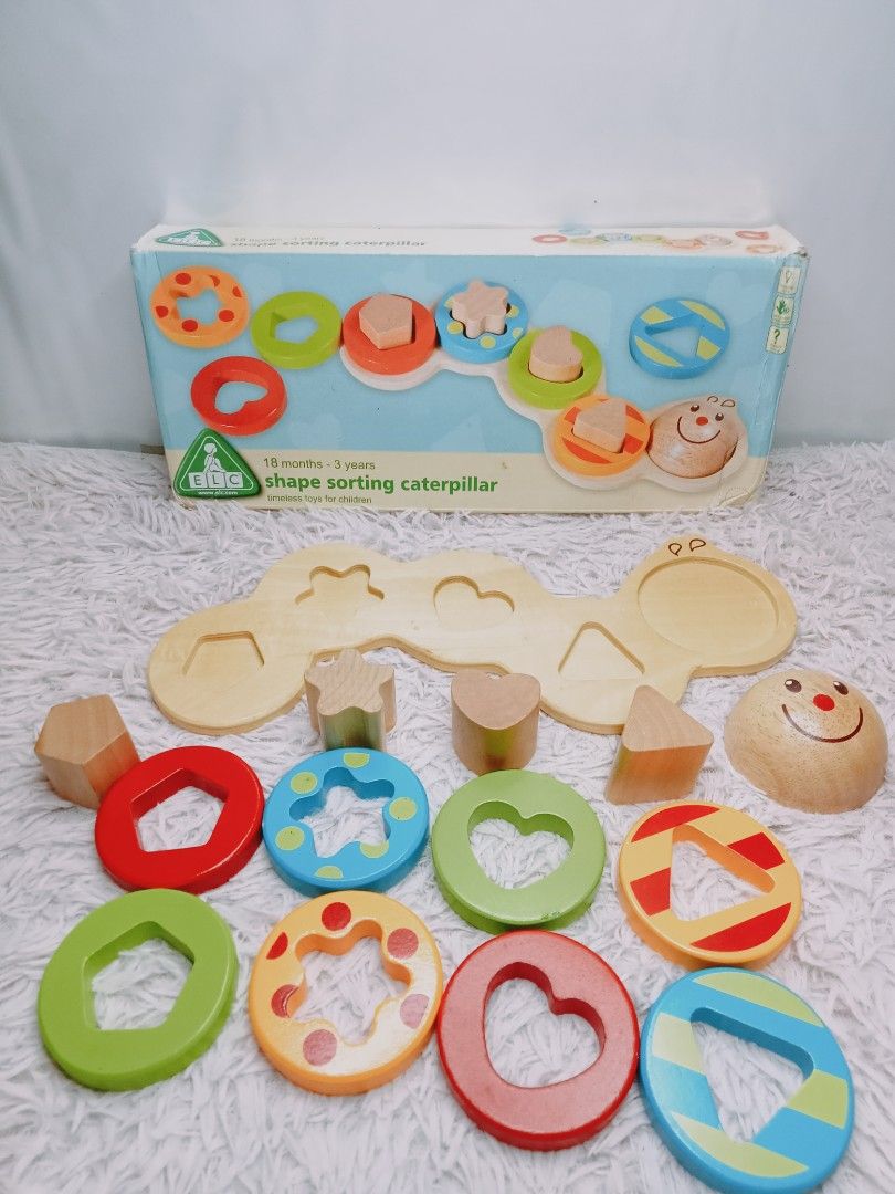 ELC Shape Sorting Caterpillar (Category: Educational & Learning Toys) located in Rosario. Submitted by elysedeclutter (Listing ID 1463380694, Image 2). Description: - ELC Shape Sorting Caterpillar Toy - Made of durable wood - Features a caterpillar base and various shape pieces - Ideal for teaching shapes and colors to young children - Recommended for ages 18 months to 3 years - Original box included.