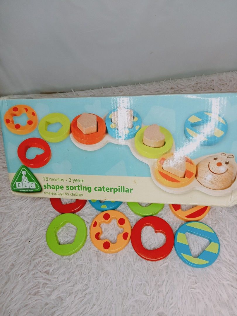 ELC Shape Sorting Caterpillar (Category: Educational & Learning Toys) located in Rosario. Submitted by elysedeclutter (Listing ID 1463380694, Image 3). Description: - ELC Shape Sorting Caterpillar Toy - Made of durable wood - Features a caterpillar base and various shape pieces - Ideal for teaching shapes and colors to young children - Recommended for ages 18 months to 3 years - Original box included.