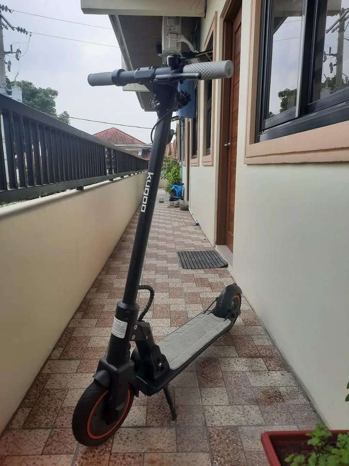 Electric Kick Scooter (Category: Skates, Rollerblades & Scooters) located in Tanza. Submitted by joviemanlangit (Listing ID 1463379156, Image 3). Description: OPEN FOR NEGOTIATION WE ACCEPT CREDIT CARD PAYMENT. - KUGOO electric scooter in black with grey grips and deck. - Digital display shows speed and battery level. - Folds for convenient storage and transport. - Ideal for fast and easy commutes or recreational rides around town..