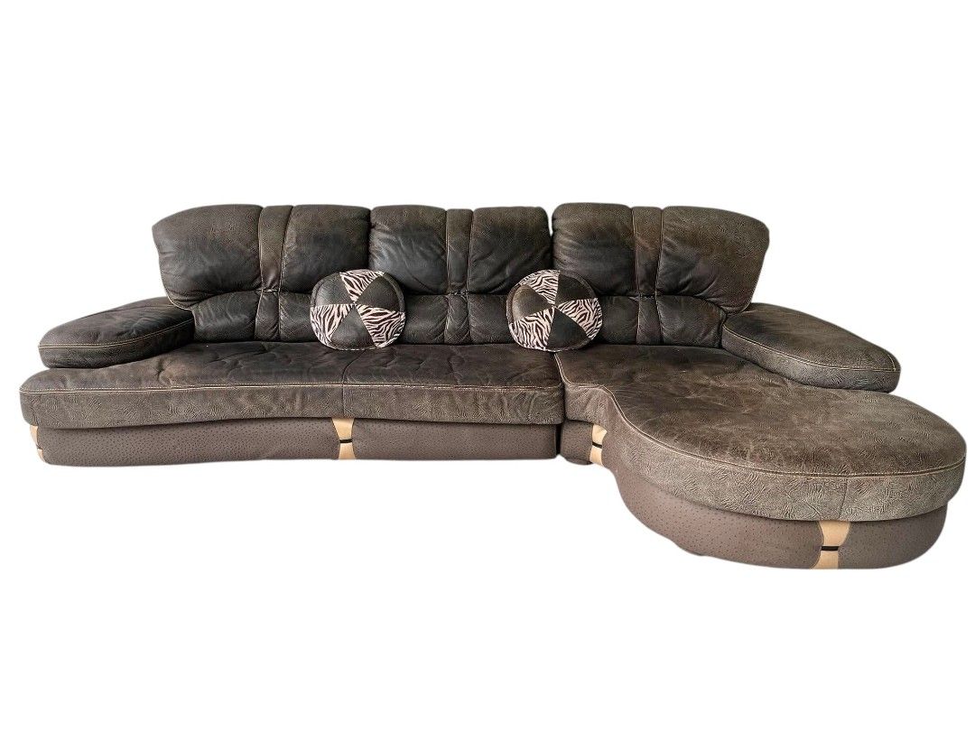 ELEGANT BIG L-TYPE GERMAN LEATHER SOFA (Category: Sofas) located in Mexico. Submitted by mgracejapansurplus (Listing ID 1463410725, Image 1). Description: NEW ARRIVAL 🔥 JAPAN SURPLUS 🇯🇵 ELEGANT BIG L-TYPE GERMAN LEATHER SOFA ✔️Luxurious dark brown textured full leather ✔️ Classic curved design with right-side rounded chaise ✔️ decorative round throw pillows with zebra-pattern accents ✔️Stitched detailing & light wood trim — premium elegant sty