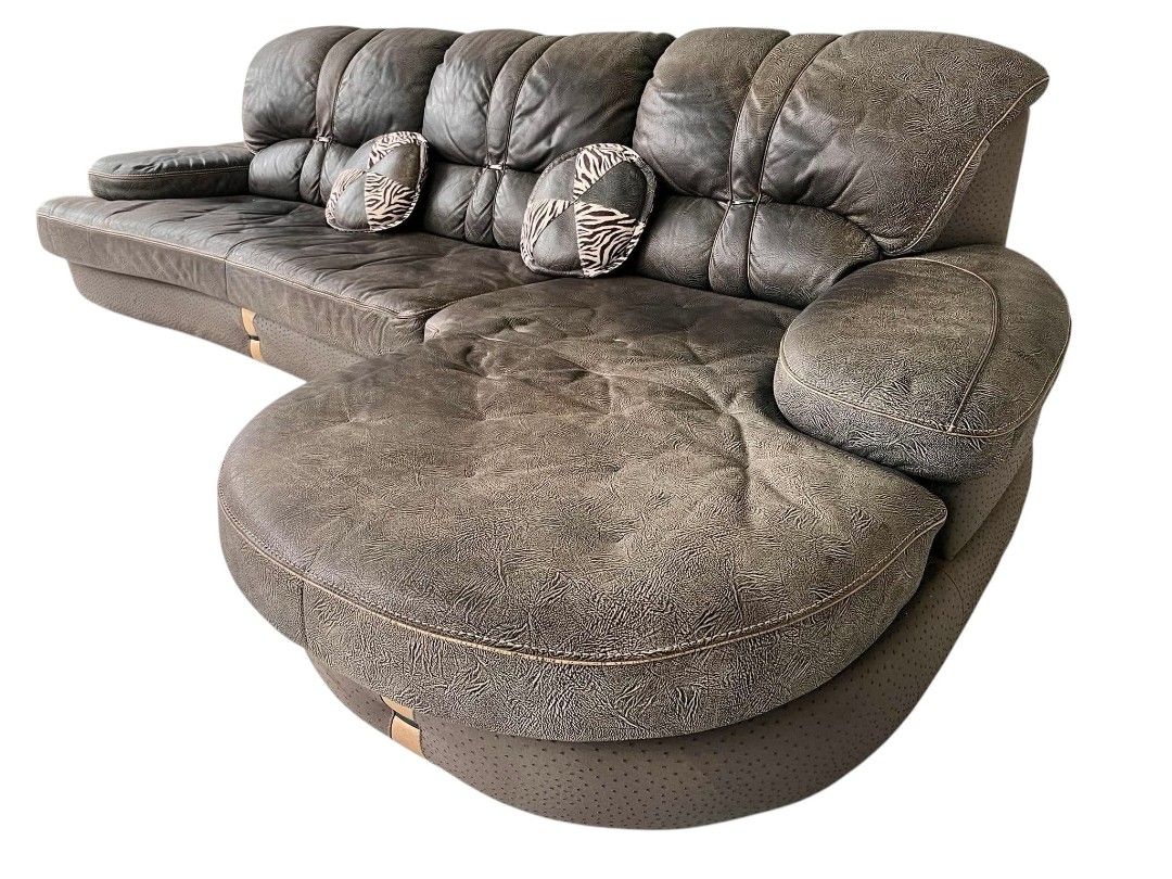 ELEGANT BIG L-TYPE GERMAN LEATHER SOFA (Category: Sofas) located in Mexico. Submitted by mgracejapansurplus (Listing ID 1463410725, Image 2). Description: NEW ARRIVAL 🔥 JAPAN SURPLUS 🇯🇵 ELEGANT BIG L-TYPE GERMAN LEATHER SOFA ✔️Luxurious dark brown textured full leather ✔️ Classic curved design with right-side rounded chaise ✔️ decorative round throw pillows with zebra-pattern accents ✔️Stitched detailing & light wood trim — premium elegant sty