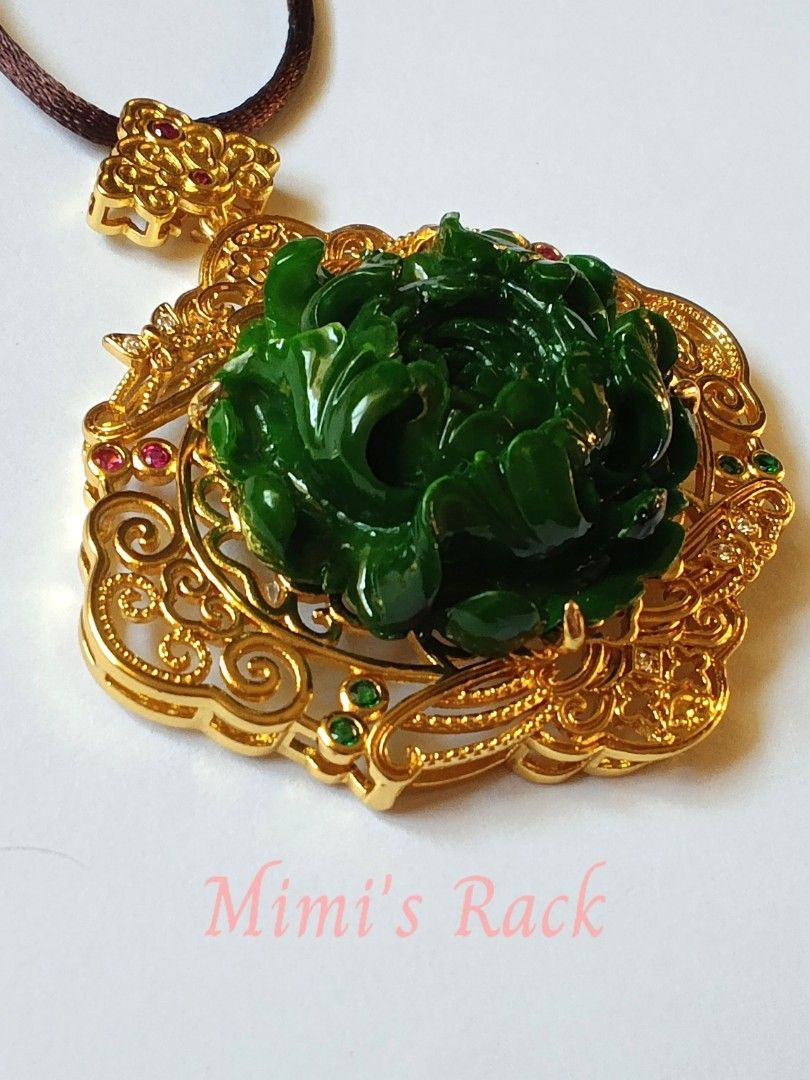 Emerald Jade Peony Carving Ruby Accent Rope Necklace (Category: Necklaces) located in Taguig. Submitted by mimisrack (Listing ID 1463331165, Image 3). Description: 💚A stunning emerald jade peony carving featuring an intricately detailed floral design with a rich, glossy green finish. The centerpiece is beautifully framed in an ornate gold-tone filigree setting, accented with ruby stones that show a lovely pink-red fluorescence under UV light. ✨ 