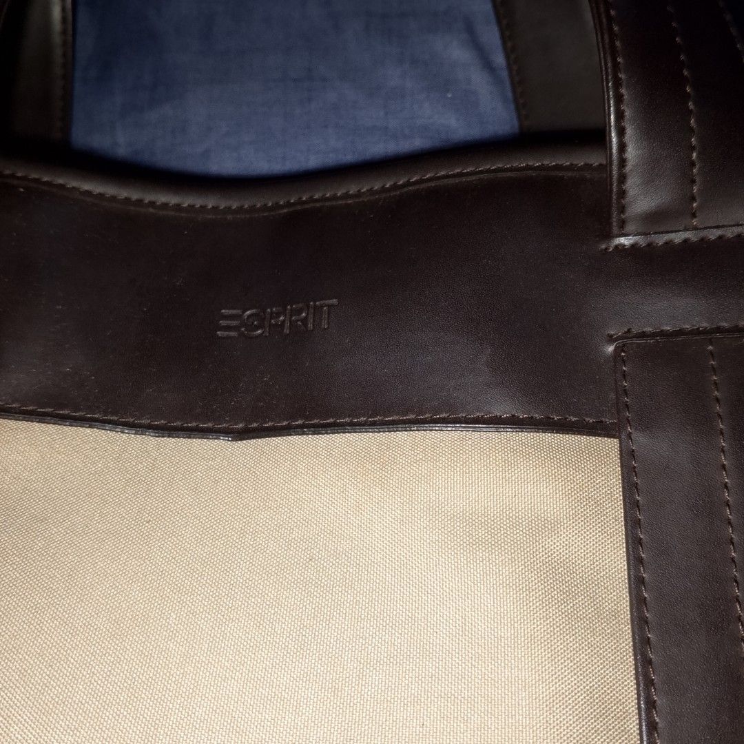 Esprit Canvas and Leather Tote Bag (Category: Tote Bags) located in Antipolo. Submitted by jomavi20 (Listing ID 1463336118, Image 3). Description: - Esprit tote bag - Color: Beige canvas with dark brown leather accents - Closure: Top zip - Straps: Comfortable shoulder straps - Features: Plenty of interior space - Style: Simple and classic design - Ideal for: Everyday use or travel.