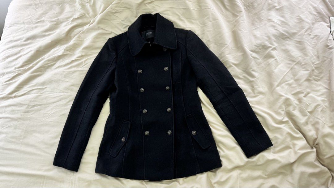 Esprit Coat (Category: Coats, Jackets and Outerwear) located in Santa Rosa. Submitted by cmasangkay (Listing ID 1463338861, Image 1). Description: Design: Double-breasted front with prominent buttons. Collar: High-closing lapel collar. Pockets: Two angled flap pockets with button details. Style: Versatile outerwear that pairs well with both casual and formal outfits. In good condition, wasnt able to remove the lints lang from laundry ;) .