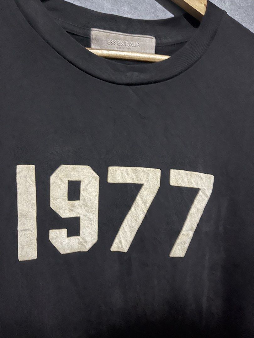 ESSENTIALS 1977 (Category: Tshirts & Polo Shirts ) located in Lucena. Submitted by mddlchld (Listing ID 1463370867, Image 3). Description: ESSENTIALS “1977” SHIRT COMPLETE TAGS SIZE MEDIUM ON TAG GOOD CONDITION COLOR RATE: 9/10 ISSUE: ₱500.