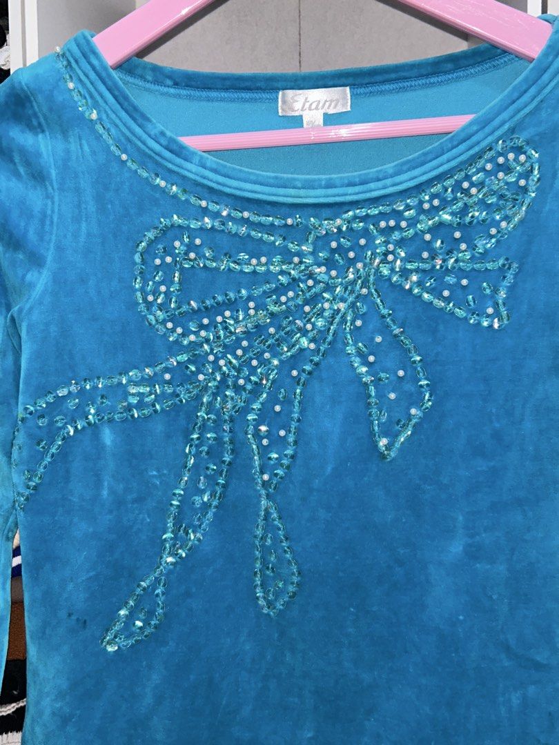 Etam Blue Velour Long Sleeve Top with Sequins Bow (Category: Longsleeves) located in Batangas. Submitted by nommi26 (Listing ID 1463401981, Image 3). Description: Brand: Etam size: fits xs to m - Blue velour long sleeve top - Brand: Etam - Features a sparkly sequin and bead bow on the front - Soft and stretchy fabric for comfort - Versatile for casual wear or dressing up - Easy to pair with jeans or skirts.