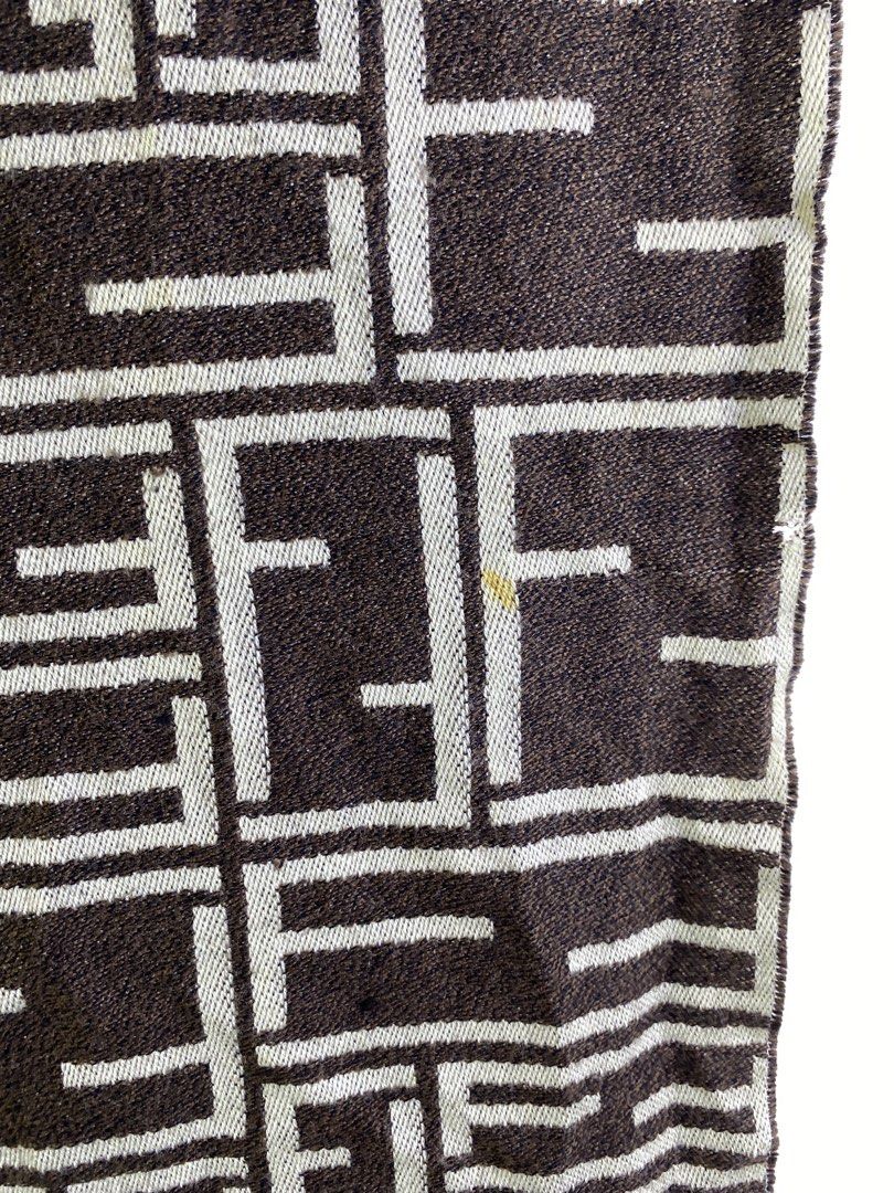 Fendi FF Monogram Scarf Brown Beige (Category: Scarves) located in Manila. Submitted by declutterpromax (Listing ID 1463402675, Image 2). Description: - Classic Fendi scarf - Iconic FF monogram pattern - Color: Brown and beige - Frayed fringe at the ends - Made in Italy - Dimensions: Approx. 15 x 60 inches - Condition: Small yellow mark on the pattern.