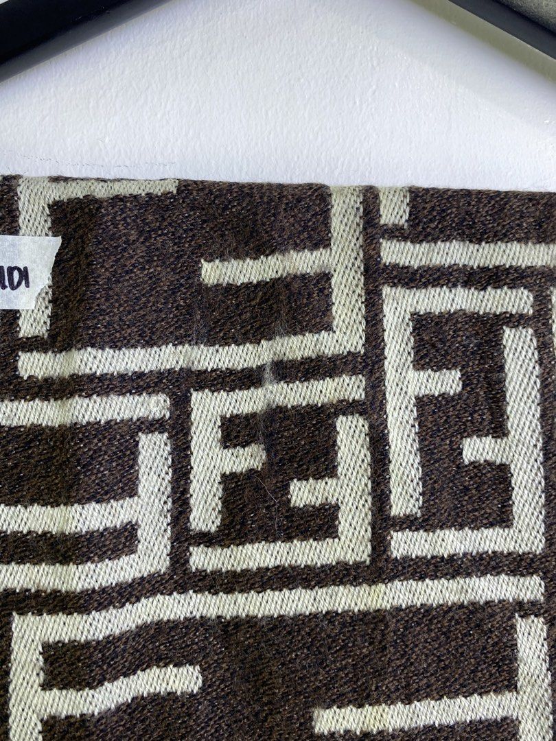 Fendi FF Monogram Scarf Brown Beige (Category: Scarves) located in Manila. Submitted by declutterpromax (Listing ID 1463402675, Image 3). Description: - Classic Fendi scarf - Iconic FF monogram pattern - Color: Brown and beige - Frayed fringe at the ends - Made in Italy - Dimensions: Approx. 15 x 60 inches - Condition: Small yellow mark on the pattern.