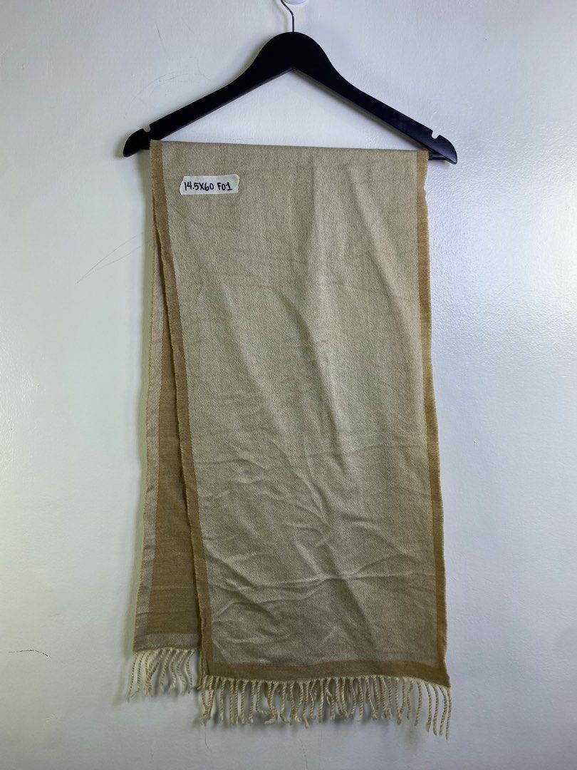 Fendi Monogram Scarf Beige (Category: Scarves) located in Manila. Submitted by declutterpromax (Listing ID 1463402651, Image 2). Description: - Fendi scarf - Classic beige with iconic FF monogram - Dimensions: 145cm x 60cm - Features fringed edges - A versatile accessory to elevate any outfit.