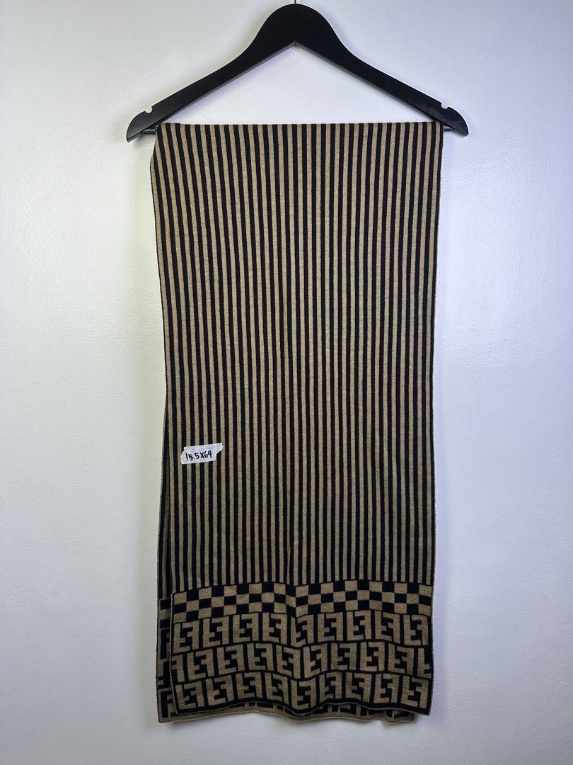 Fendi Striped Scarf with FF Logo (Category: Scarves) located in Manila. Submitted by declutterpromax (Listing ID 1463407531, Image 1). Description: - Fendi scarf - Iconic FF logo pattern at hem - Classic beige and black stripes - Soft knit material for comfort - Versatile designer accessory - Approximate dimensions: 15.5 x 64 inches.