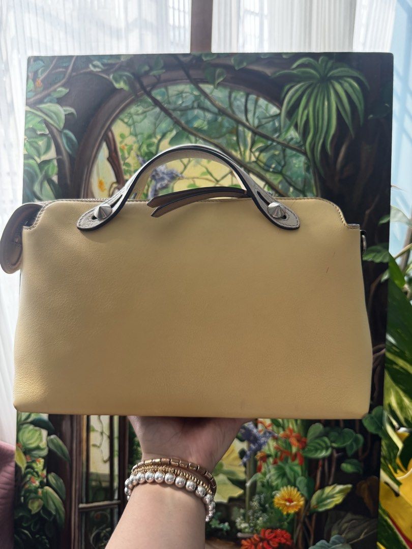 Fendi Top Handle Bag (Category: Luxury Bags & Wallets) located in Pasig City. Submitted by artsandbestofbags (Listing ID 1463420133, Image 2). Description: - Genuine Fendi Roma bag in vibrant yellow leather. - Versatile with top handles and a detachable strap. - Smoothly functioning zippers. - Comes with original Fendi dust bag. - Ideal for everyday carry..
