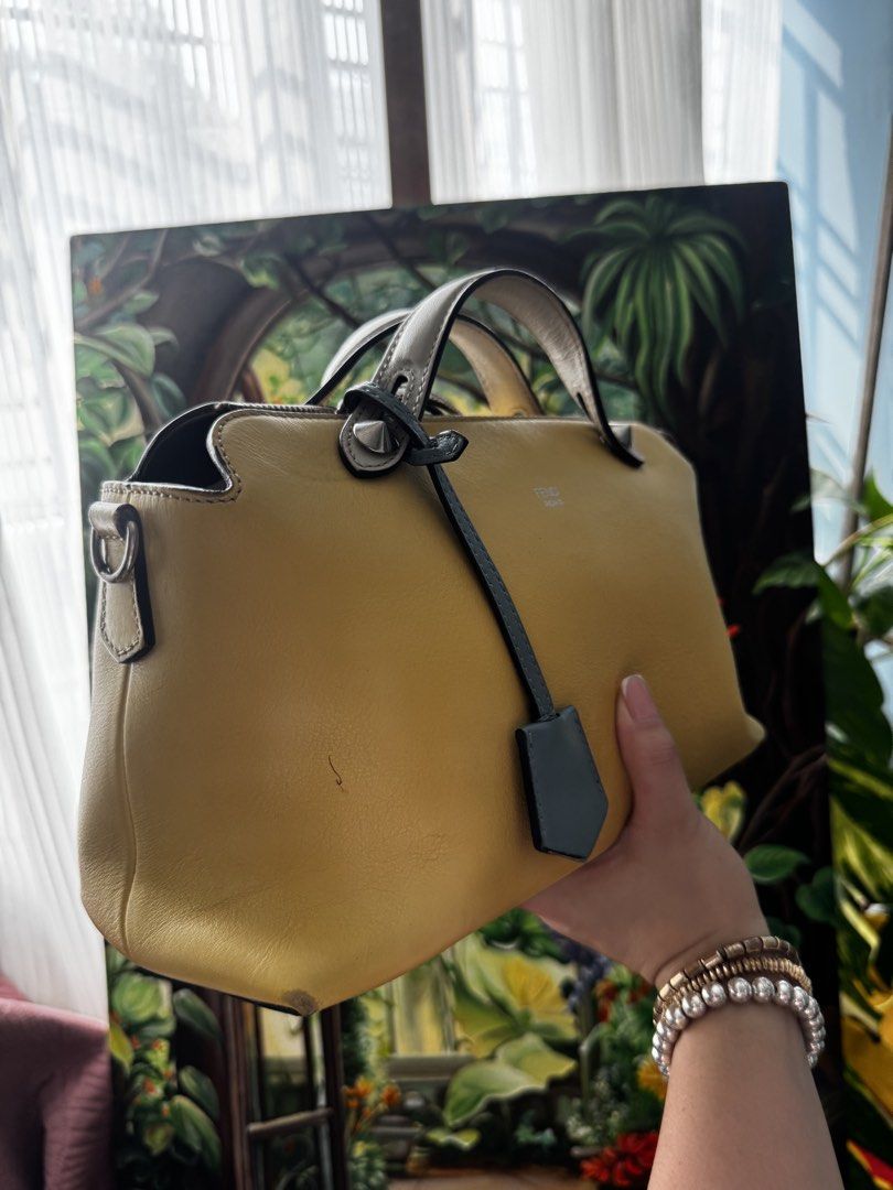 Fendi Top Handle Bag (Category: Luxury Bags & Wallets) located in Pasig City. Submitted by artsandbestofbags (Listing ID 1463420133, Image 3). Description: - Genuine Fendi Roma bag in vibrant yellow leather. - Versatile with top handles and a detachable strap. - Smoothly functioning zippers. - Comes with original Fendi dust bag. - Ideal for everyday carry..