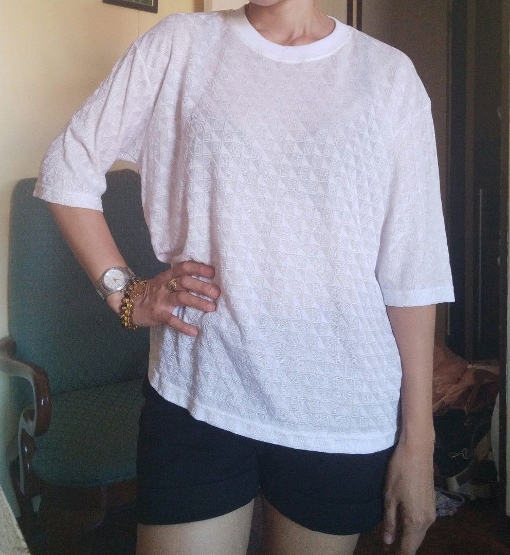 Fendi white printed FF (Category: Blouses) located in Angeles City. Submitted by mjshoppingretail (Listing ID 1463331884, Image 1). Description: orig Fendi FF print like new meduim L L.