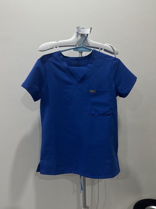 FIGS Royal Blue V-Neck Scrub Top XS (Category: Others Tops) located in Cavite. Submitted by prelovedbymaeve (Listing ID 1459285049, Image 1). Description: - FIGS Royal Blue V-Neck Scrub Top - Short sleeves - Chest pocket - Comfortable and durable fabric - Designed for easy movement - Ideal for work or everyday use.