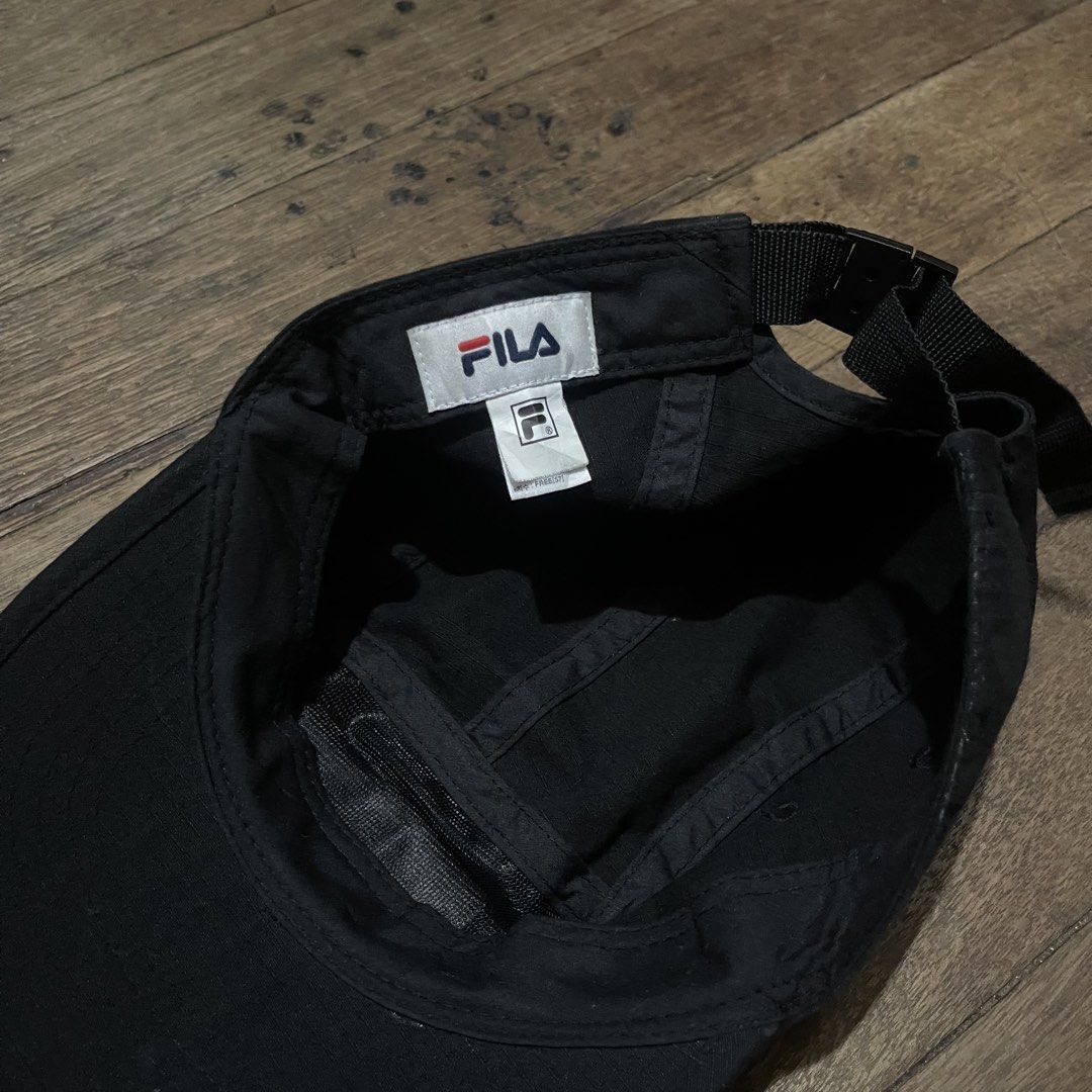 Fila Black 5-Panel Cap (Category: Caps & Hats) located in Manila. Submitted by bravebird_164362 (Listing ID 1463451872, Image 3). Description: - Classic black 5-panel cap - Features iconic Fila logo patch on the front - Adjustable strap at the back for a comfortable fit - Simple and versatile design - Great for everyday wear and easy to match with any outfit GOOD AS NEW NO FLAWS DM.