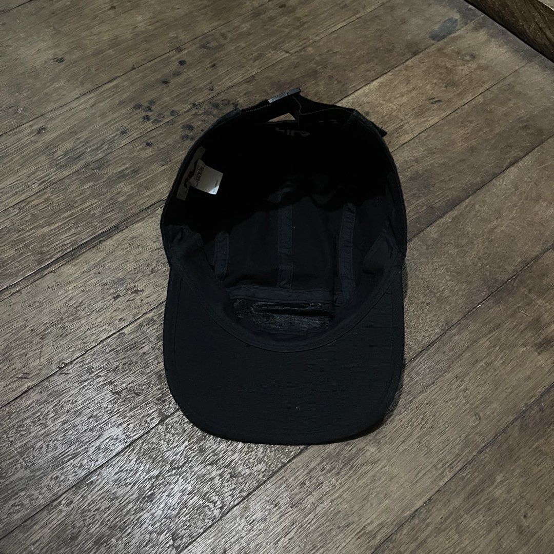 Fila Black 5-Panel Cap (Category: Caps & Hats) located in Manila. Submitted by bravebird_164362 (Listing ID 1463451872, Image 2). Description: - Classic black 5-panel cap - Features iconic Fila logo patch on the front - Adjustable strap at the back for a comfortable fit - Simple and versatile design - Great for everyday wear and easy to match with any outfit GOOD AS NEW NO FLAWS DM.