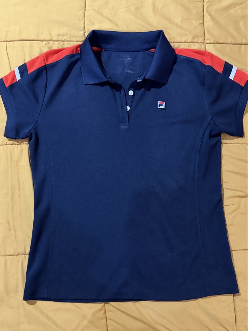 Fila Navy Blue Polo Shirt (Category: Shirts) located in Mandaluyong City. Submitted by xela.tings (Listing ID 1463459925, Image 1). Description: Classic Fila polo shirt Red and white stripe details on shoulders and sleeves Great for sports or casual wear.