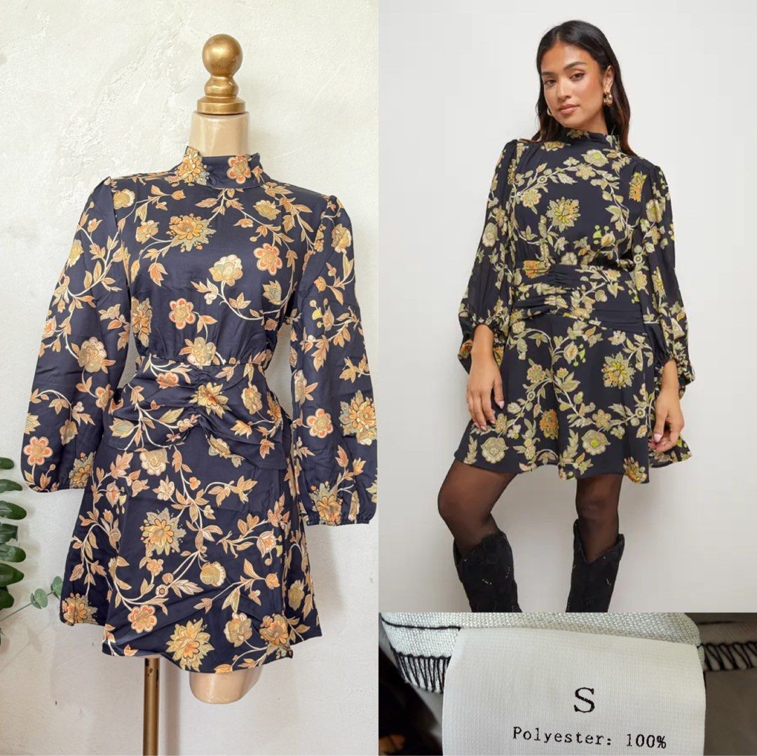 Floral Print High Neck Mini Dress (Category: Dresses) located in Santa Rosa. Submitted by martess (Listing ID 1463471321, Image 1). Description: - Dark navy mini dress - Vintage-inspired floral print - High neckline - Long balloon sleeves - Cinched waist with ruching for a flattering silhouette - Draped, ruched skirt - Ideal for nights out or special occasions - Material: 100% Polyester.
